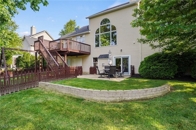 1288 Windward Ln, Kent, OH 44240 - back of property with a wooden deck, stairs, and a patio area