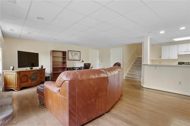 1288 Windward Ln, Kent, OH 44240 - living room featuring light wood-style floors, a drop ceiling, stairs, and recessed lighting