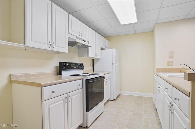 1288 Windward Ln, Kent, OH 44240 - kitchen featuring under cabinet range hood, range with electric cooktop, white cabinets, light countertops, and a paneled ceiling