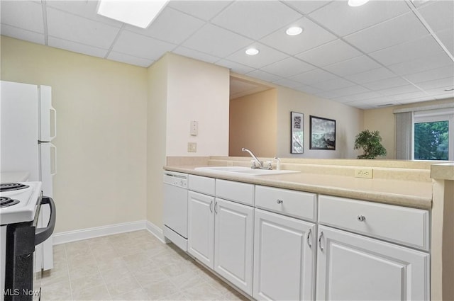 1288 Windward Ln, Kent, OH 44240 - kitchen with white appliances, white cabinets, a drop ceiling, light countertops, and recessed lighting