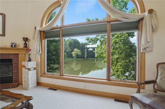 1288 Windward Ln, Kent, OH 44240 - interior space with carpet, healthy amount of natural light, a water view, and a brick fireplace