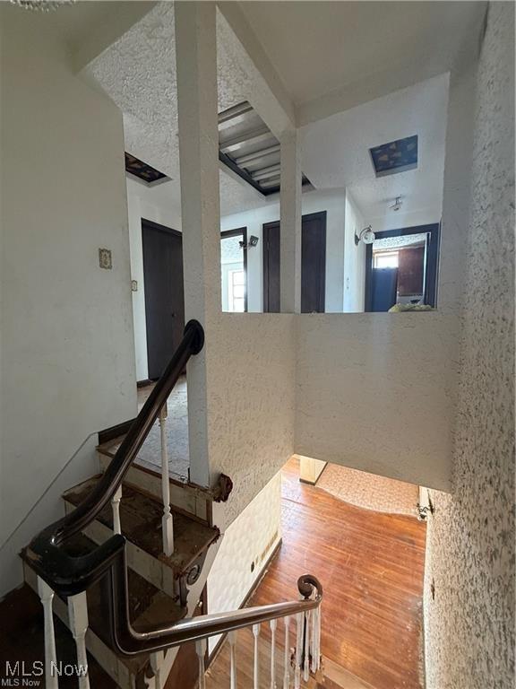 522 N 3rd St, Toronto, OH 43964 - staircase featuring wood finished floors