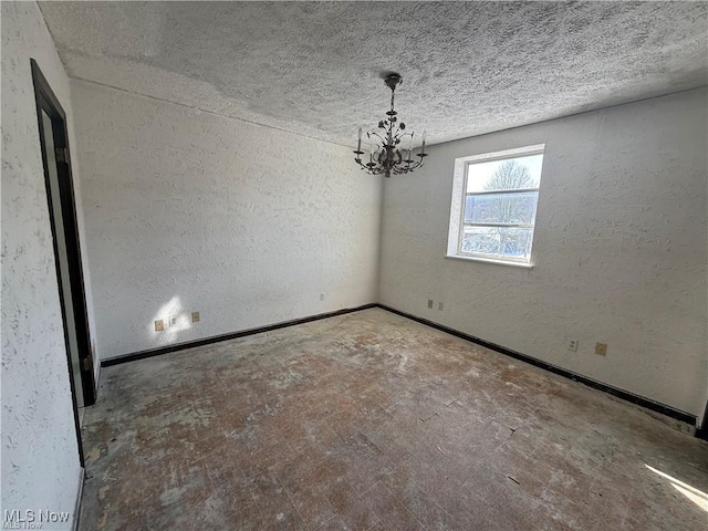 522 N 3rd St, Toronto, OH 43964 - spare room with a chandelier, a textured wall, and a textured ceiling