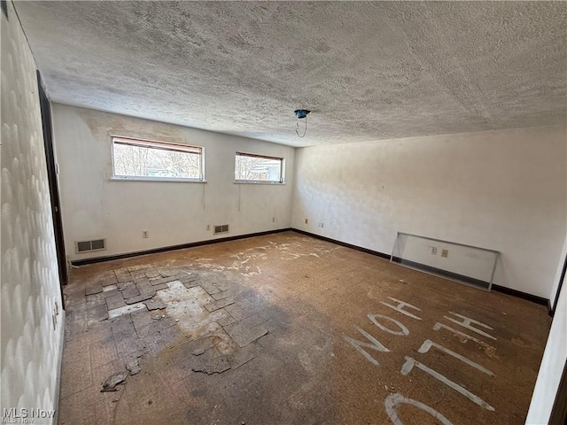 522 N 3rd St, Toronto, OH 43964 - spare room featuring a textured ceiling