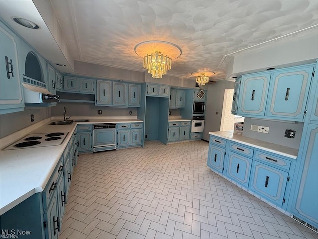 522 N 3rd St, Toronto, OH 43964 - kitchen featuring oven, a chandelier, white electric stovetop, blue cabinets, and brick patterned floors