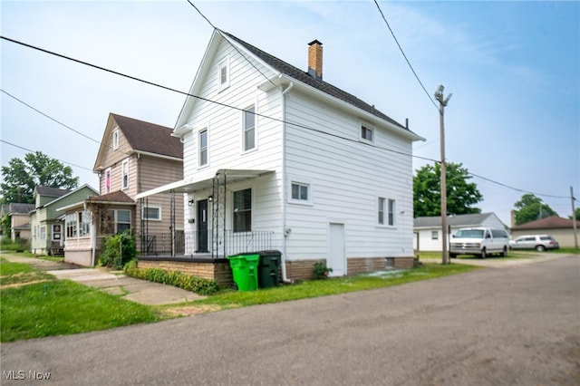 326 N Park Ave, Alliance, OH 44601 - view of side of property featuring a chimney