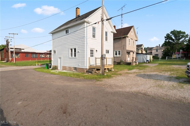 326 N Park Ave, Alliance, OH 44601 - view of property exterior with a chimney and a deck