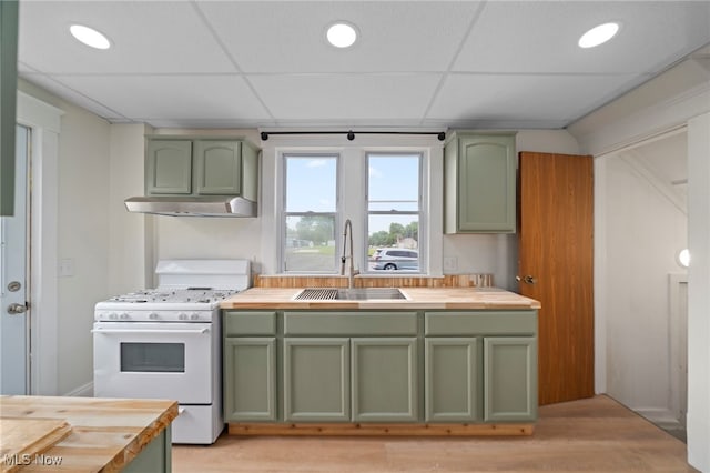 326 N Park Ave, Alliance, OH 44601 - kitchen featuring green cabinets, butcher block counters, a paneled ceiling, and recessed lighting