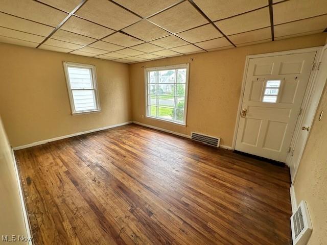 21316 Watson Rd, Maple Heights, OH 44137 - foyer entrance with hardwood / wood-style floors, plenty of natural light, and a drop ceiling
