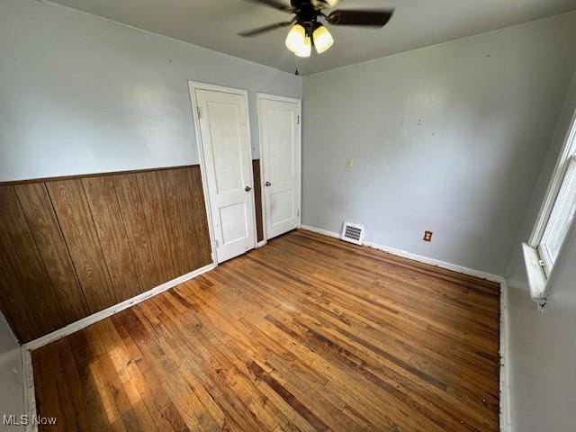 21316 Watson Rd, Maple Heights, OH 44137 - unfurnished bedroom with wood-type flooring and a ceiling fan