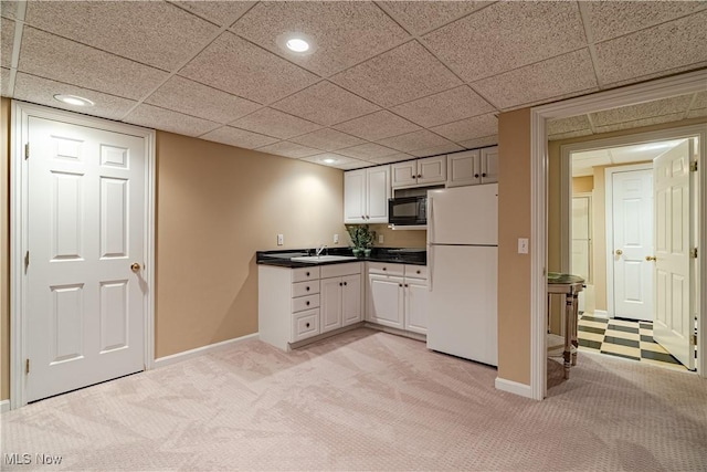 7488 Valley View Rd, Hudson, OH 44236 - kitchen featuring black appliances, light carpet, dark countertops, recessed lighting, and white cabinetry