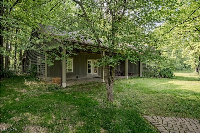 7488 Valley View Rd, Hudson, OH 44236 - view of green lawn featuring a patio area and french doors