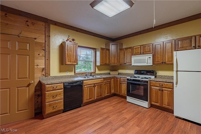 7488 Valley View Rd, Hudson, OH 44236 - kitchen featuring white appliances, brown cabinetry, light wood finished floors, and light countertops