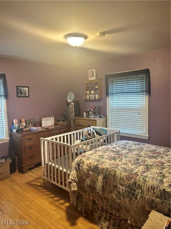 7438 Westview Dr, Youngstown, OH 44512 - bedroom with multiple windows and hardwood / wood-style flooring