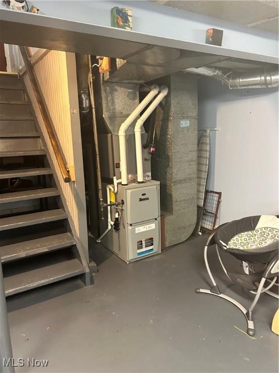 7438 Westview Dr, Youngstown, OH 44512 - unfinished below grade area with stairs and heating unit