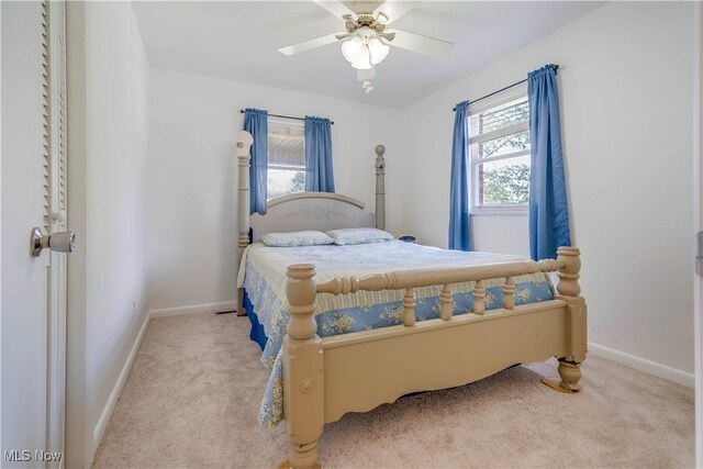 1701 19th Ave, Parkersburg, WV 26101 - bedroom with carpet, multiple windows, and a ceiling fan