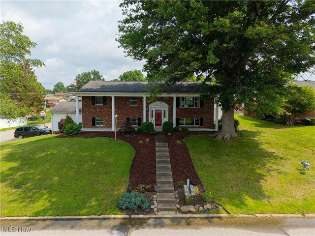 1701 19th Ave, Parkersburg, WV 26101 - raised ranch with brick siding and a front yard