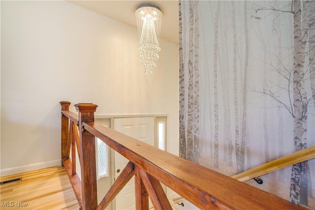 1701 19th Ave, Parkersburg, WV 26101 - staircase featuring a chandelier and wood finished floors