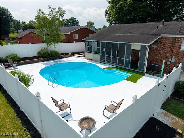 1701 19th Ave, Parkersburg, WV 26101 - view of pool featuring a sunroom, a patio, and a fenced backyard