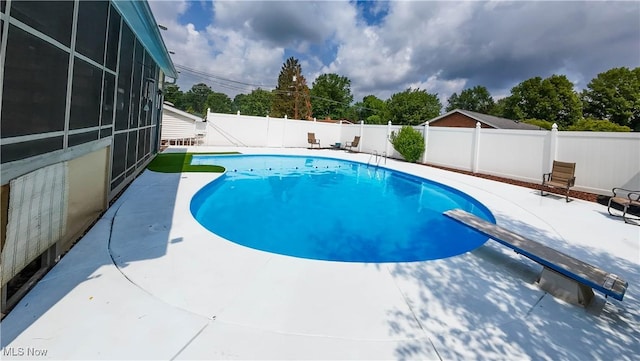 1701 19th Ave, Parkersburg, WV 26101 - view of swimming pool featuring a patio area, a fenced backyard, a sunroom, and a diving board