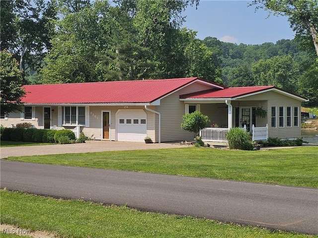 7261 Austin Dr, Mcconnelsville, OH 43756 - ranch-style house featuring a porch, a garage, driveway, a front yard, and a metal roof