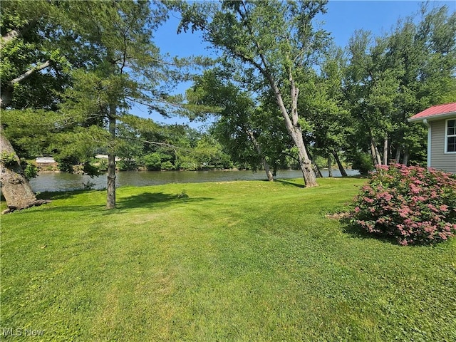 7261 Austin Dr, Mcconnelsville, OH 43756 - view of green lawn with a water view