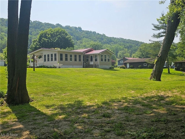 7261 Austin Dr, Mcconnelsville, OH 43756 - rear view of property featuring a lawn and a metal roof