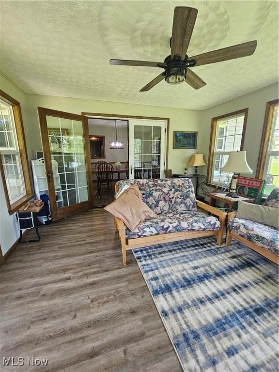 7261 Austin Dr, Mcconnelsville, OH 43756 - living area featuring wood finished floors, a textured ceiling, and a ceiling fan