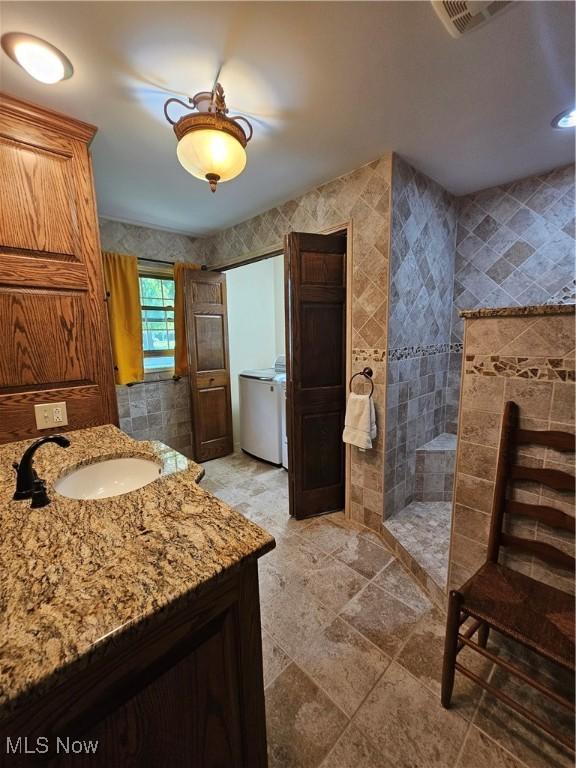 7261 Austin Dr, Mcconnelsville, OH 43756 - full bathroom with walk in shower, separate washer and dryer, and vanity