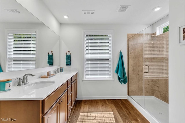 23200 St Andrews Dr, Columbia Station, OH 44028 - full bathroom with double vanity, wood finished floors, a shower stall, and recessed lighting