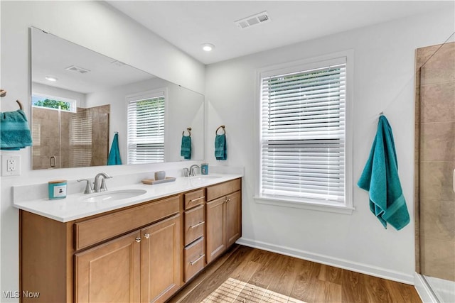 23200 St Andrews Dr, Columbia Station, OH 44028 - bathroom featuring double vanity, a stall shower, wood finished floors, and recessed lighting