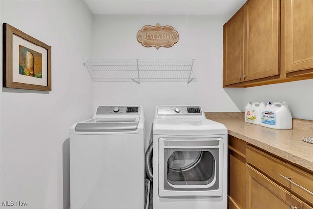 23200 St Andrews Dr, Columbia Station, OH 44028 - washroom featuring separate washer and dryer and cabinet space