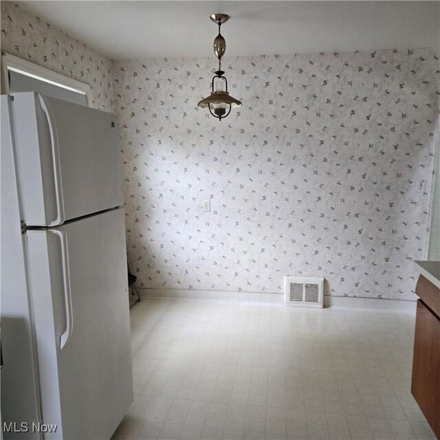 331 E 264th St, Euclid, OH 44132 - unfurnished dining area featuring wallpapered walls and baseboards