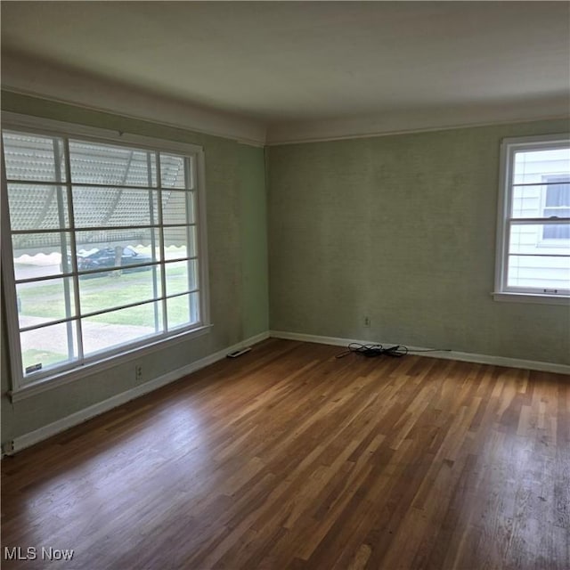 331 E 264th St, Euclid, OH 44132 - empty room with dark wood finished floors and healthy amount of natural light