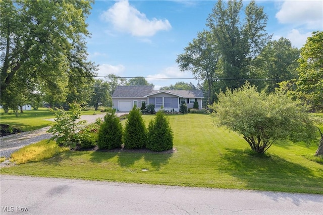 14203 Hatfield Rd, Rittman, OH 44270 - view of front facade featuring driveway, a front yard, and an attached garage