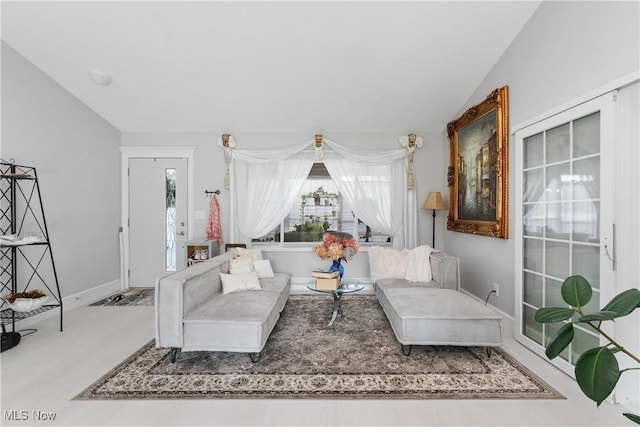 14203 Hatfield Rd, Rittman, OH 44270 - living room featuring lofted ceiling and baseboards