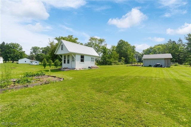 14203 Hatfield Rd, Rittman, OH 44270 - view of grassy yard featuring an outbuilding