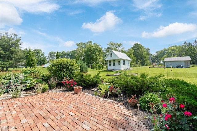 14203 Hatfield Rd, Rittman, OH 44270 - view of patio / terrace with view of scattered trees and an outbuilding