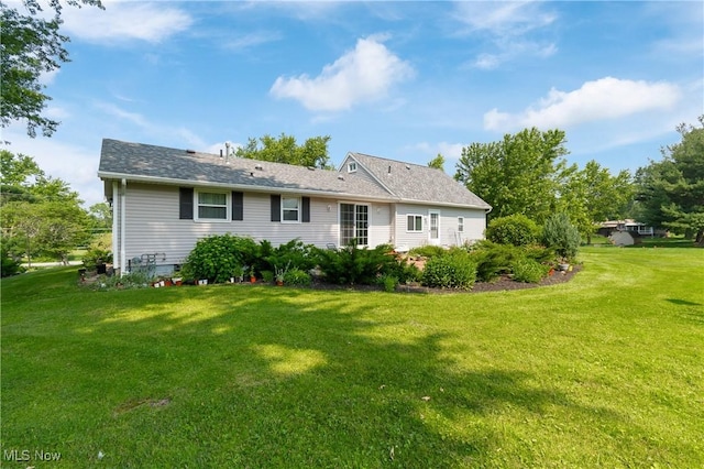 14203 Hatfield Rd, Rittman, OH 44270 - back of house featuring a yard