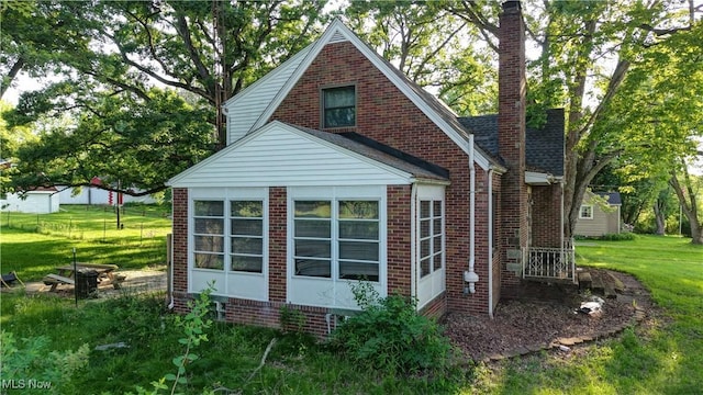 2335 Southway St SW, Massillon, OH 44646 - view of home's exterior featuring brick siding and a yard