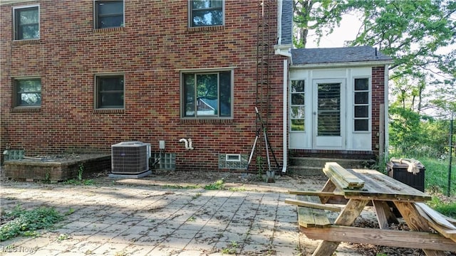 2335 Southway St SW, Massillon, OH 44646 - rear view of house featuring a patio, brick siding, and entry steps
