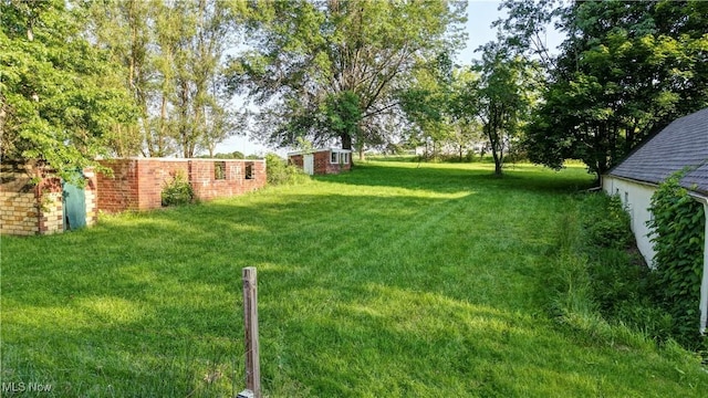 2335 Southway St SW, Massillon, OH 44646 - view of grassy yard with an outdoor structure