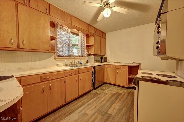 2335 Southway St SW, Massillon, OH 44646 - kitchen with stainless steel dishwasher, white range with electric stovetop, light wood-type flooring, open shelves, and light countertops