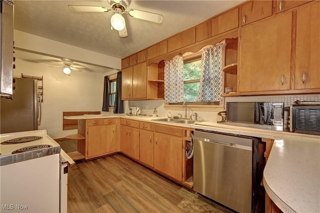 2335 Southway St SW, Massillon, OH 44646 - kitchen featuring open shelves, appliances with stainless steel finishes, ceiling fan, and light wood-style flooring