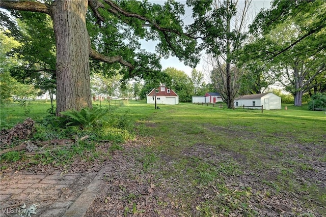 2335 Southway St SW, Massillon, OH 44646 - view of grassy yard featuring an outbuilding