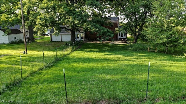 2335 Southway St SW, Massillon, OH 44646 - view of yard with a garage and french doors