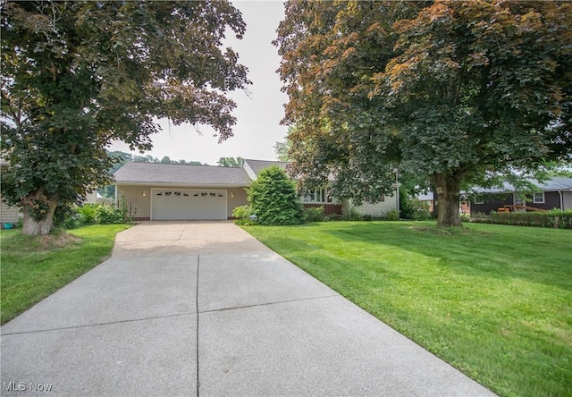 809 Mcdaniel Ave, Minerva, OH 44657 - view of front of property with a garage, a front lawn, and driveway