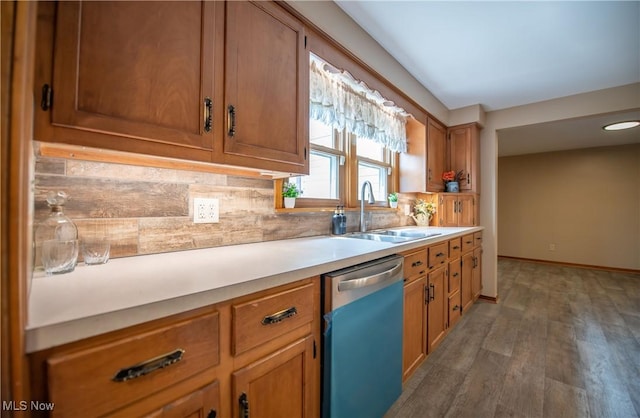 809 Mcdaniel Ave, Minerva, OH 44657 - kitchen featuring dishwasher, decorative backsplash, light countertops, brown cabinetry, and wood finished floors