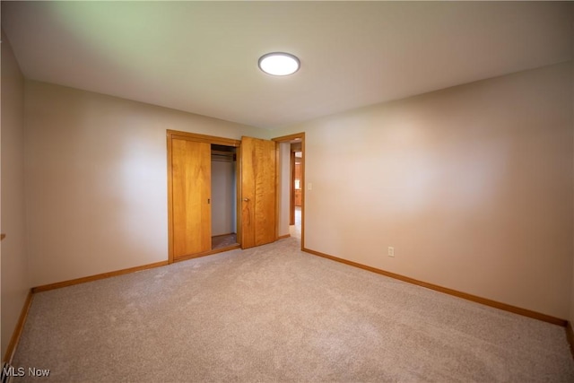 809 Mcdaniel Ave, Minerva, OH 44657 - unfurnished bedroom with light carpet and a closet