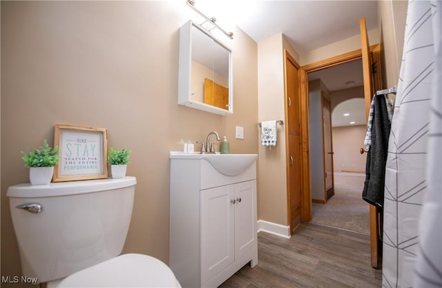 809 Mcdaniel Ave, Minerva, OH 44657 - half bathroom with wood finished floors and vanity